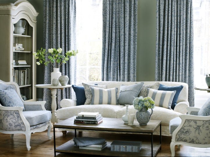 long blue curtains in elegant drawing room
