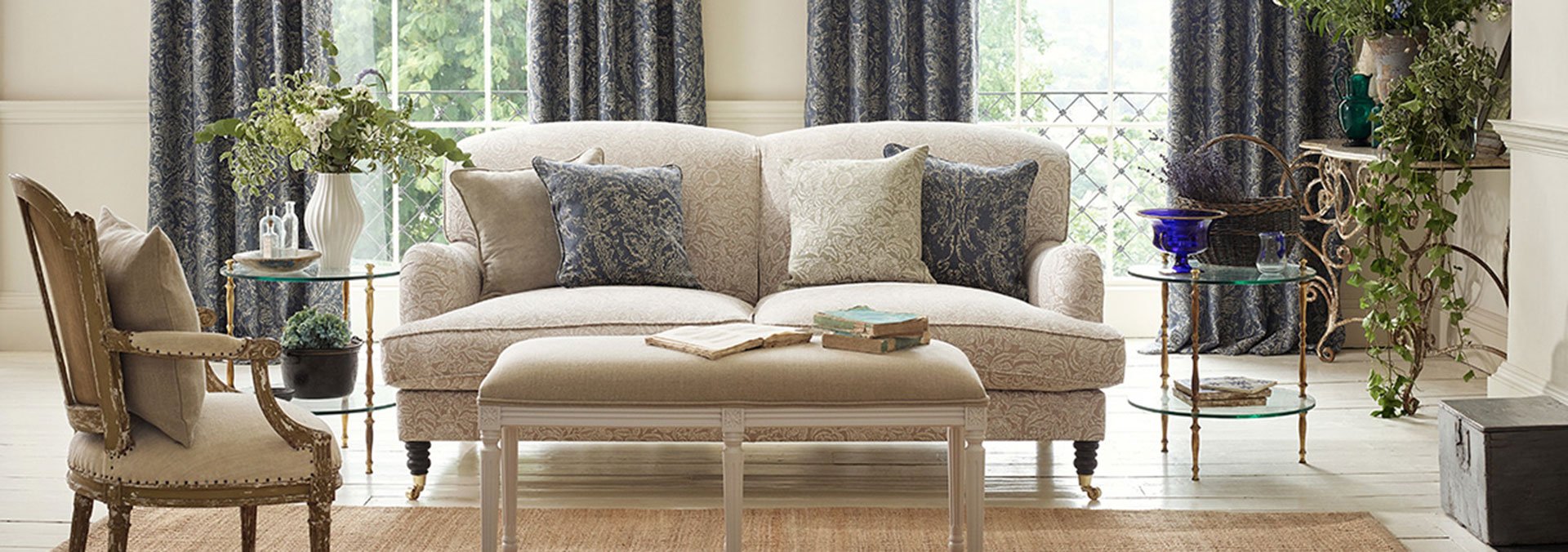 Sitting room with blue damask curtains and soft furnishings